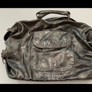 Latico gold & Black Metallic handbag.